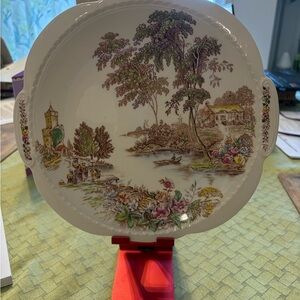 Scenic Ceramic Plate with Floral Accents